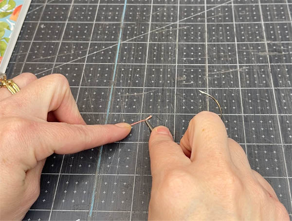 how to thread a curved book binding needle